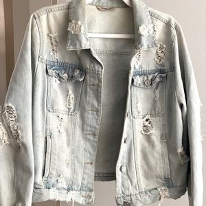 Light Wash distressed Denim Jacket. Size XL - fits like a Medium.